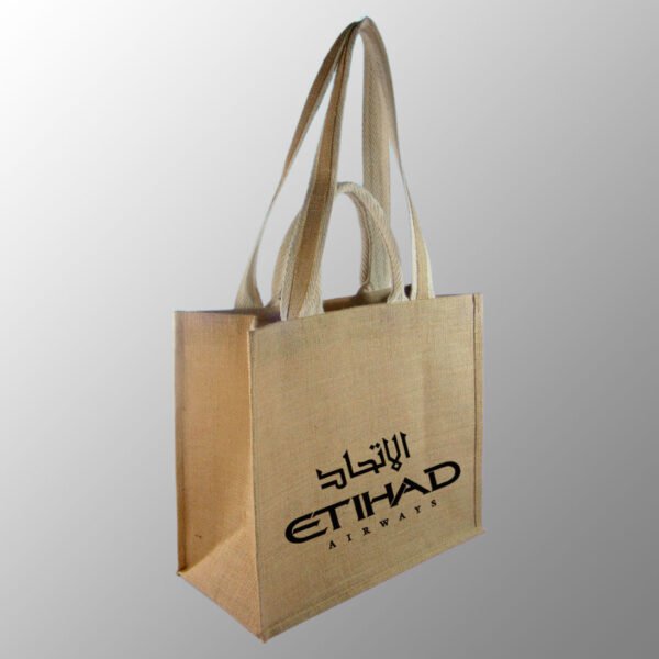 Jute Bag With Double Handles. Customized with one-color screen print in your required artwork for free with up to 25% ink coverage. Model # 2067 is made from Natural 14x 15 way of Jute with PP Matt Lamination Inside.